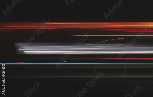 Super fast car lights in minimal style. Motion colorful urban background texture. Modern cityscape road traffic. Travel concept. Science hyperspeed teleport movement. Time machine.