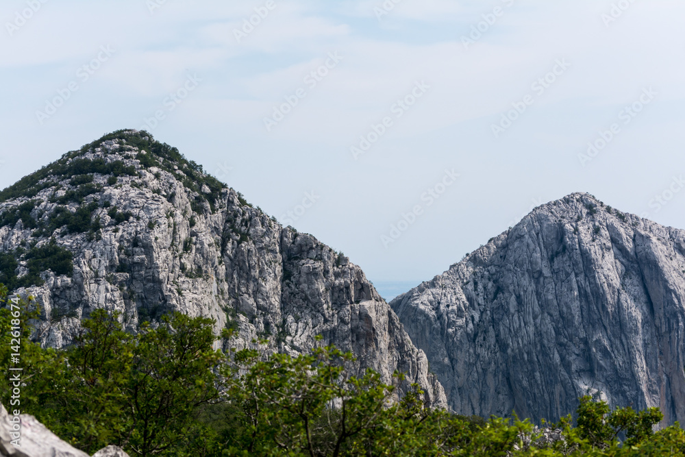 High peaks, ridges and forests on hillsides in mountains of Paklenica national park, Croatia