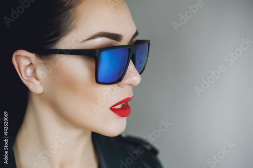 Wallpaper Mural  beautiful punk woman model wearing sun glasses and leather jacket. Beautiful girl in a black leather jacket. Beautiful sexy woman with black leather jacket. Torontodigital.ca