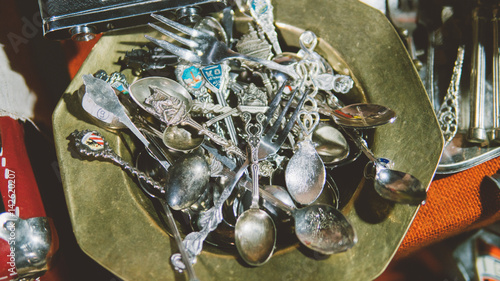 vintage sterling silver spoon. Flea markets of Europe and vintage household items. Silver spoons and knives. Shallow focus 