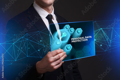 Business, Technology, Internet and network concept. Young businessman working on a virtual screen of the future and sees the inscription: Personal data protection