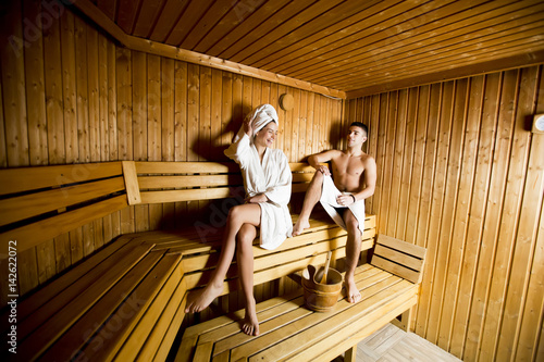 Young couple relaxing in sauna