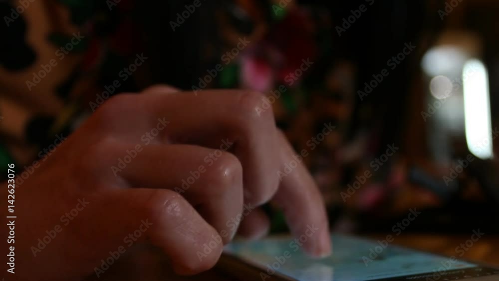 Closeup of young woman hand typing sms scrolling pictures phone. Soft focus. Closeup of young woman hand typing sms scrolling pictures phone. Soft focus.