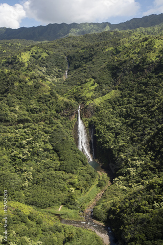 Aerial view of waterfall Manawaiopuna Falls, used in Jurassic park, Kauai, Hawaii 