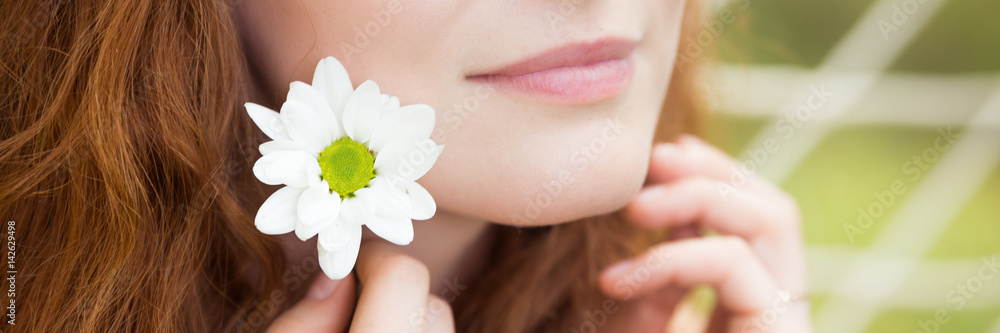 Natural beautiful woman with a fresh flower Natural beautiful woman with a fresh flower