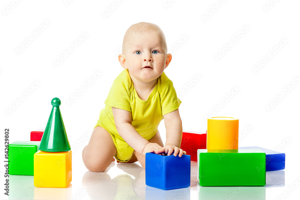 Boy play dice in bright clothes Boy play dice in bright clothes