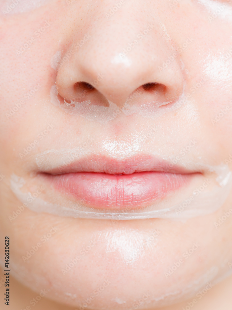 Fototapeta premium Close up woman in facial peel off mask.