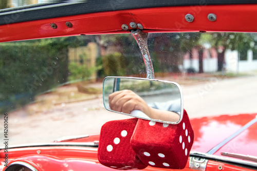 Hanging red fuzzy dice photo