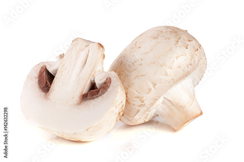 champignon mushrooms and half isolated on white background