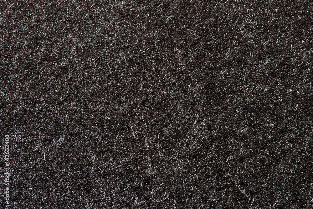 Fototapeta premium Texture of organic black paper for artwork with numerous natural inclusions. Modern dark background, backdrop, substrate, composition use with copy space