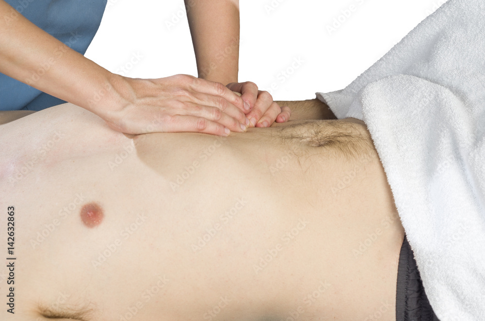 Physiotherapist is doing an activation of the diaphragm. Massage to a man patient.. Physiotherapist is doing an activation of the diaphragm. Massage to a man patient..