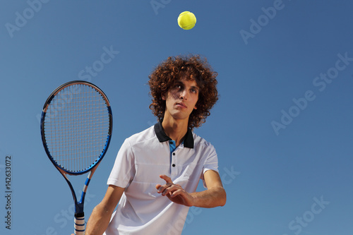 tennis player with racket during a match game © amedeoemaja
