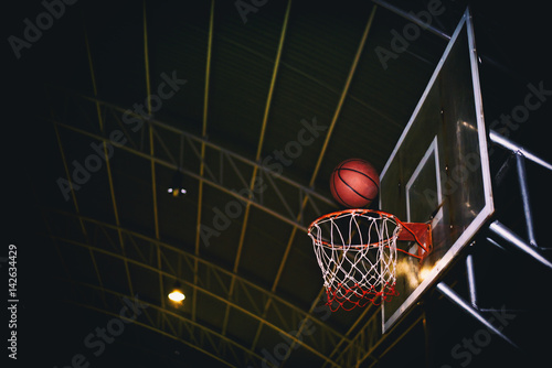The winning points scoring at a basketball game. Lowkey vintage background and selection focus.