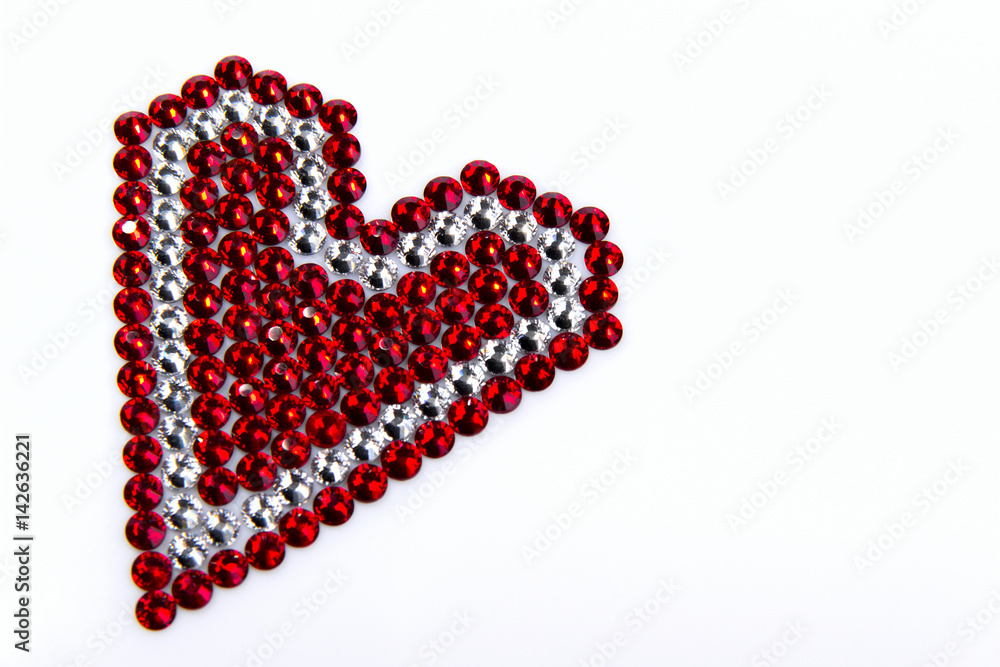 Precious Sparkling Rhinestones Red and Crystal Colors, Folded Heart Shaped, on a White Background.