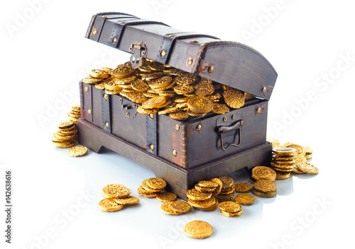 Open treasure chest with gold coins isolated on white