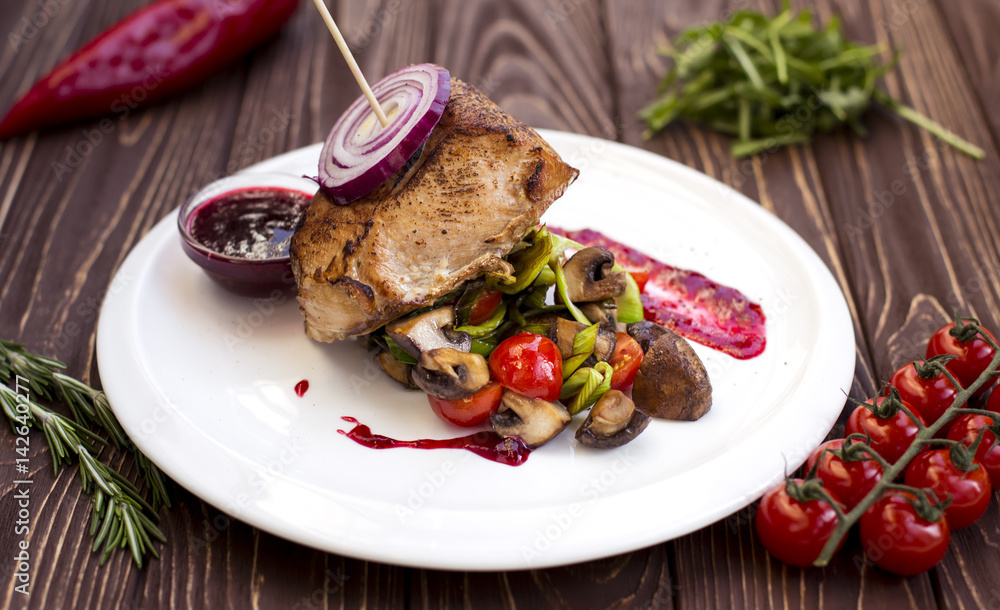 Delicious beef steak. Grilled beef steak with tomato and Mushrooms Delicious beef steak. Grilled beef steak with tomato and Mushrooms