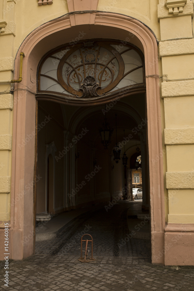 Old arched entrance with stained glass window Old arched entrance with stained glass window