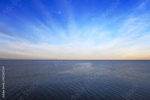 Blue sky above clean sea