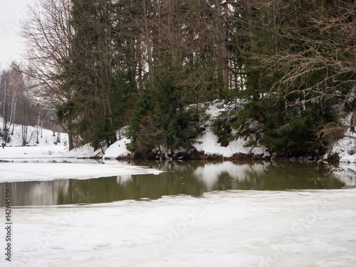 Wallpaper Mural Landscape with a winter lake with ice and green water Torontodigital.ca