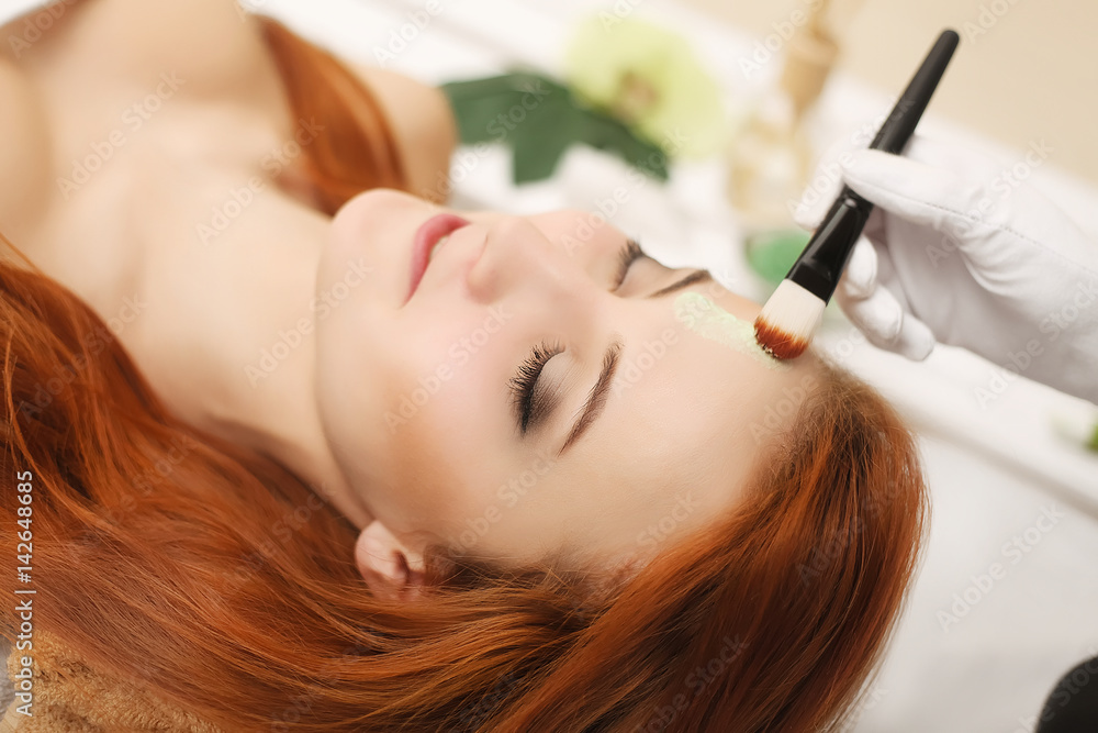 Fototapeta premium Spa Relaxation. Woman Body Care. Beautiful Sexy Caucasian Girl In Bikini Lying In Resort Day Spa Salon. Beauty Treatment, Skin Care Therapy. Wellness. Healthy Lifestyle Concept
