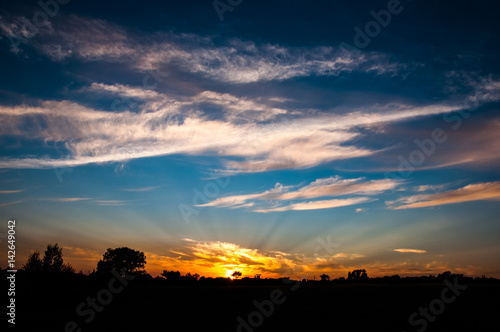 Sun rays in the sky. Sunset scene landscape