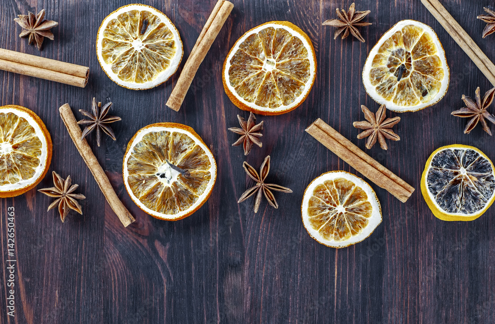 Circles of dried orange on a brown wooden surface Circles of dried orange on a brown wooden surface