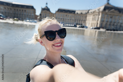 A portrait of a Happy young caucasian woman take selfie, smile to camera © Myvisuals