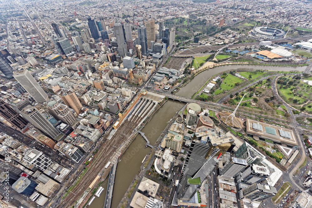 Aerial view over Southbank, Melbourne CBD and MCG under overcast skies (Victoria, Australia)