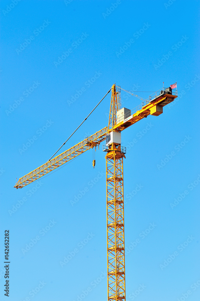 A construction crane in downtown Chicago. A high volume of new construction in the city provides evidence of an economic recovery. A construction crane in downtown Chicago. A high volume of new construction in the city provides evidence of an economic recovery.