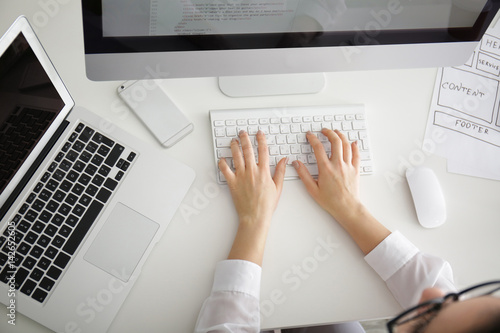 Woman programmer working at...