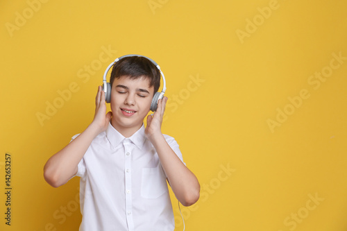 Teenager with headphones li...