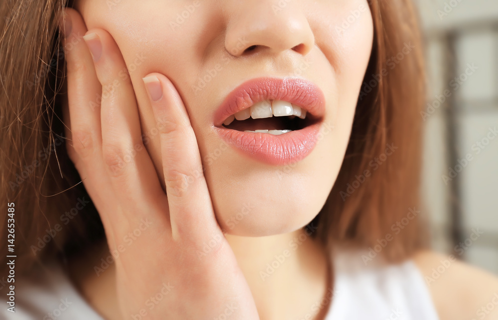 Young woman suffering from toothache, closeup Young woman suffering from toothache, closeup