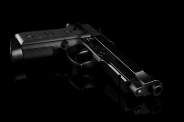 Gun on black background