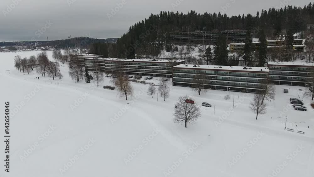 Aerial view of a cyclist on a snow covered road. Aerial view of a cyclist on a snow covered road.