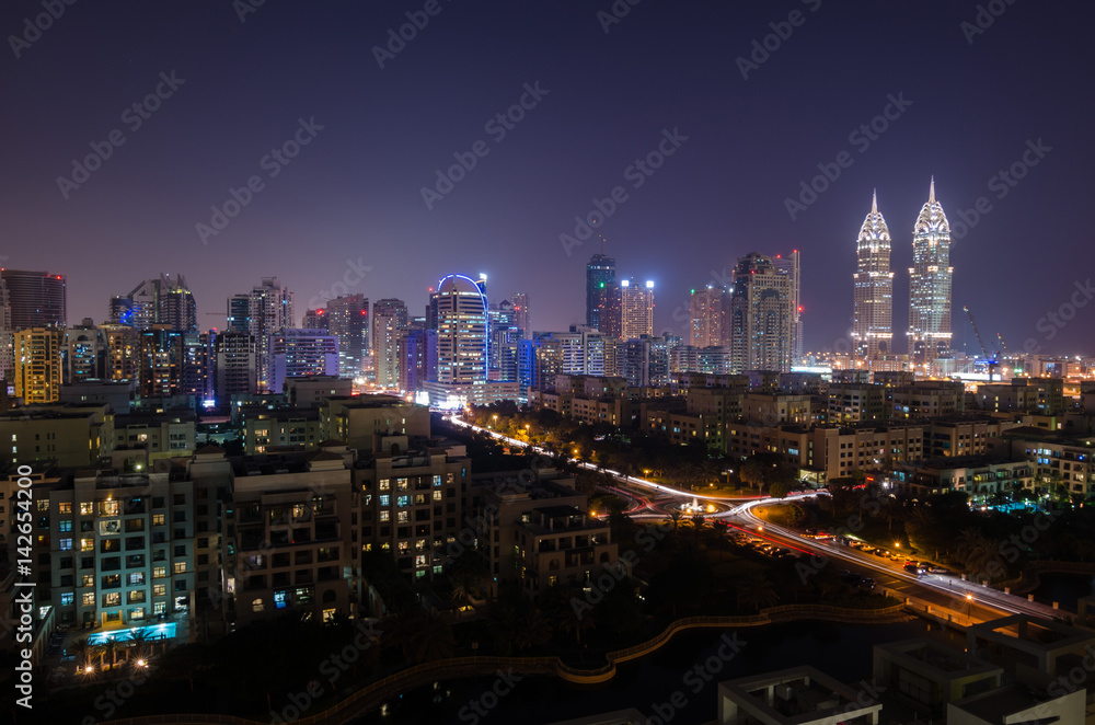 dubai, united arab emirates, 05/05/2016 tecom dubai business towers at night lit up, tecom dubai, uae.