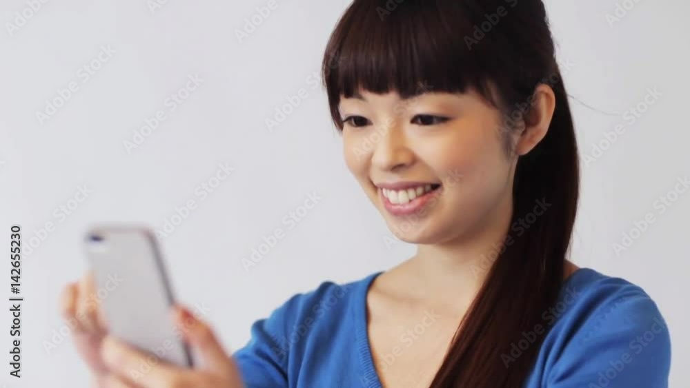 happy smiling asian woman with smartphone happy smiling asian woman with smartphone