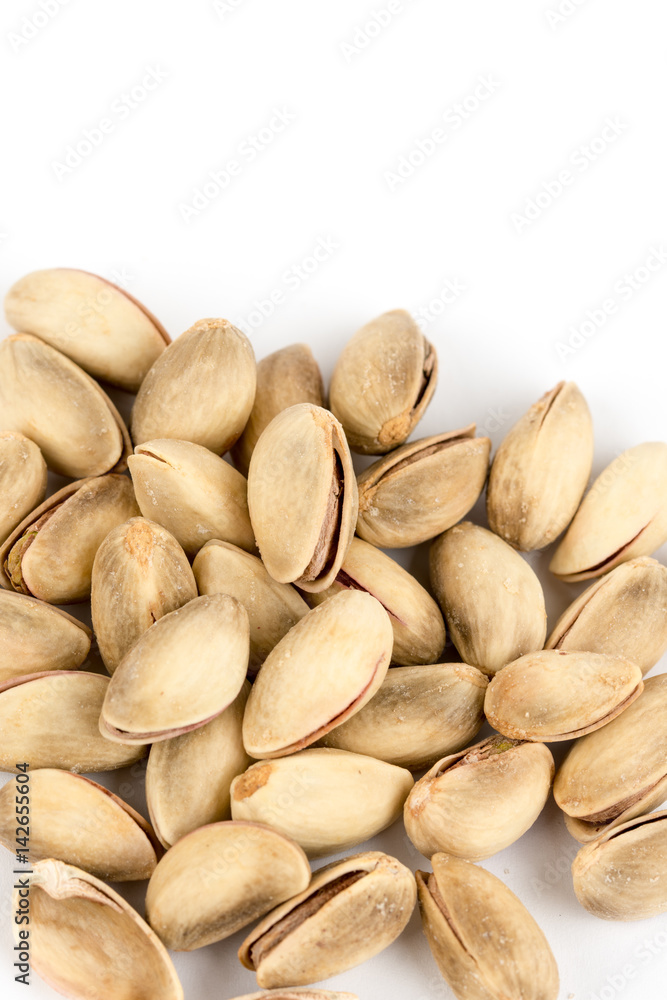 Pile of roasted pistachio over white background Pile of roasted pistachio over white background