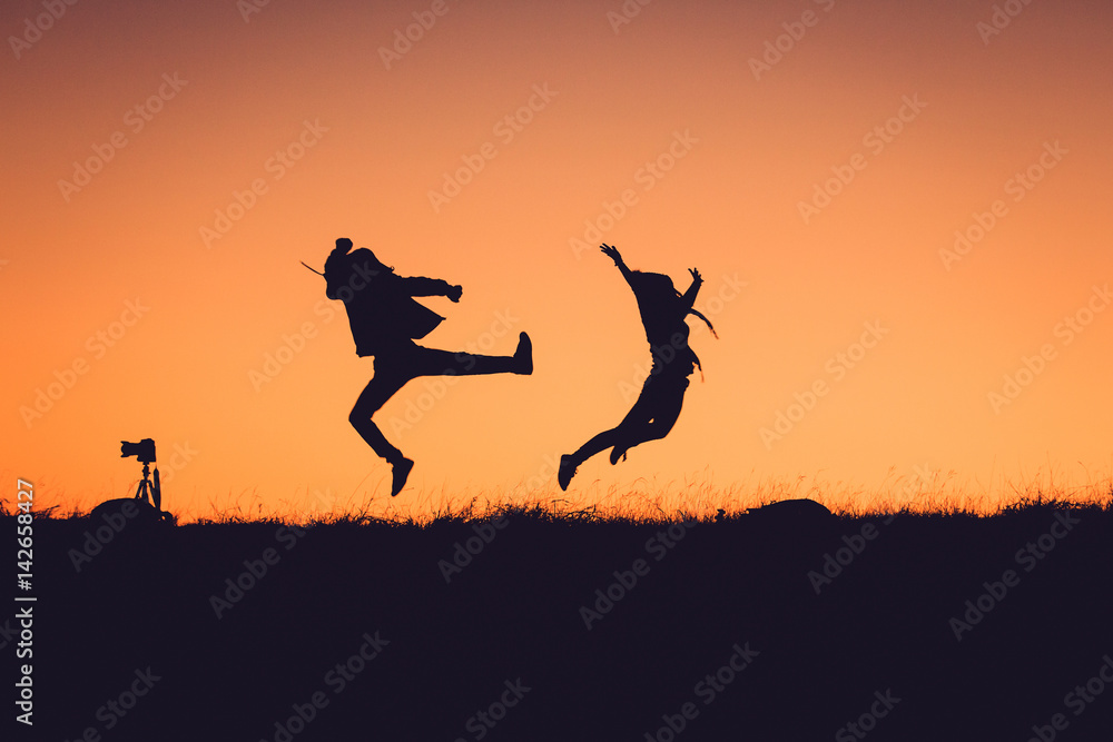 Silhouette Of People having fun at sunset time