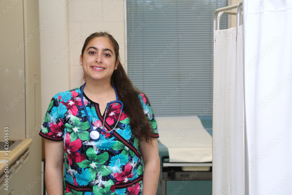 Portrait of a young attractive hispanic female healthcare worker in medical clinic Portrait of a young attractive hispanic female healthcare worker in medical clinic