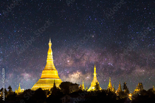 Shwedagon pagoda with milky way in the night sky in Yangon Myanmar