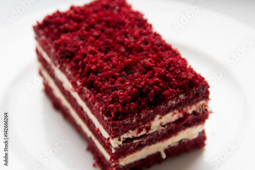 red velvet slice of cake on white plate