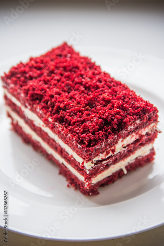 red velvet slice of cake on white plate