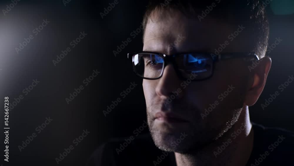 Portrait of a man close-up. Reflection of the monitor in glasses. Portrait of a man close-up. Reflection of the monitor in glasses.