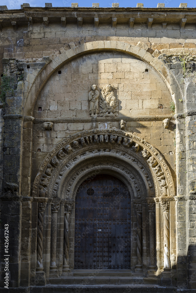 Fototapeta premium Detail of the southern facade of Santa Maria Church, in Uncastillo, Zaragoza, Aragon, eastern Spain. It was built between 1135 and 1155 in Romanesque style