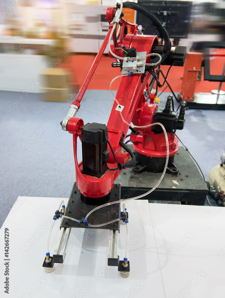Robotic arm at production line in factory Robotic arm at production line in factory