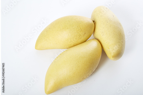 Yellow mango  on a white  background