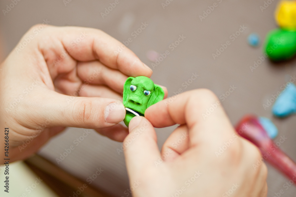 Modeling clay. Man sculpts from clay. Modeling clay. Man sculpts from clay.