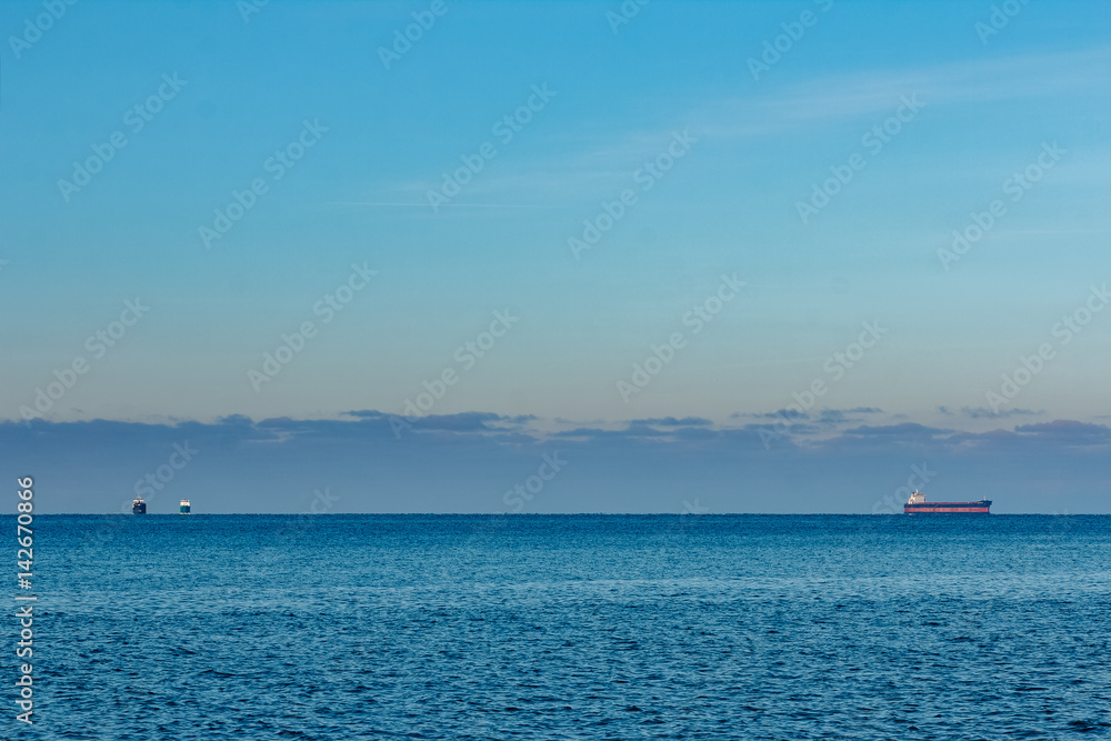 Cargo ship anchored far in the Baltic sea. Europe
