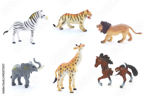 Collage of toy animals isolated on white background