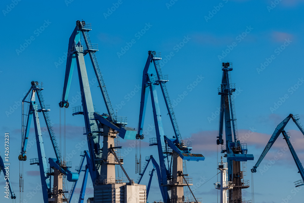 Blue cargo cranes in the port of Riga, Europe